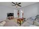 Spacious living room with a TV, comfortable seating, and plenty of room to entertain at 11616 Thacker Dr, Clermont, FL 34711