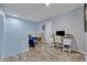 Upstairs loft area featuring a comfortable chair, desk, and modern decor at 11616 Thacker Dr, Clermont, FL 34711