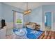 Play room with a comfortable sitting area, ' toys, and a view to the backyard at 11616 Thacker Dr, Clermont, FL 34711