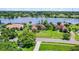 Stunning lakefront home with lush lawn and mature trees in a desirable neighborhood at 13626 Sunset Lakes Cir, Winter Garden, FL 34787