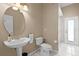 Clean and simple bathroom with a pedestal sink, a toilet, and a stand-up shower at 13626 Sunset Lakes Cir, Winter Garden, FL 34787