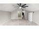 Large bedroom with sloping ceilings, gray walls, a bathroom, large ceiling fan and open floorplan at 13626 Sunset Lakes Cir, Winter Garden, FL 34787