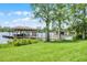 This house has a dock with a covered boat house and waterfront access on a beautiful lake at 13626 Sunset Lakes Cir, Winter Garden, FL 34787
