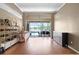 Spacious living room with hardwood floors, neutral walls, and scenic lake views at 13626 Sunset Lakes Cir, Winter Garden, FL 34787