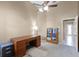 Cozy home office with carpet floors, a bookcase, and a large desk; perfect for work or study at 13626 Sunset Lakes Cir, Winter Garden, FL 34787