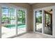 Bright sunroom with access to the patio and pool area, featuring tile floors at 13626 Sunset Lakes Cir, Winter Garden, FL 34787