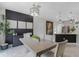 Elegant dining area adjacent to the kitchen, complete with stylish decor and ample seating at 1391 Shinnecock Hills Dr, Davenport, FL 33896