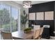 Bright dining room featuring modern light fixture, dark accent wall and sliding glass doors at 1391 Shinnecock Hills Dr, Davenport, FL 33896