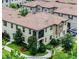 Beautiful two-story home boasts a well-manicured lawn, lush landscaping, and a charming balcony perfect for relaxation at 1391 Shinnecock Hills Dr, Davenport, FL 33896