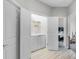 Hallway with laundry area featuring a washer and dryer unit, with bedrooms off to the side at 1391 Shinnecock Hills Dr, Davenport, FL 33896
