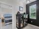 Hallway featuring display cabinet and view into bedroom at 1391 Shinnecock Hills Dr, Davenport, FL 33896