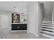 Contemporary kitchen with an island that includes pendant lighting and leads to a staircase at 1391 Shinnecock Hills Dr, Davenport, FL 33896