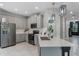 Stylish kitchen with stainless steel appliances, updated countertops, and ample cabinet space at 1391 Shinnecock Hills Dr, Davenport, FL 33896