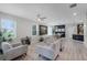 Bright living room with modern furnishings, sleek ceiling fan, and lots of natural light at 1391 Shinnecock Hills Dr, Davenport, FL 33896