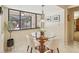Bright breakfast nook with a glass table and a view of the screened porch at 1425 Mt Laurel Dr, Winter Springs, FL 32708