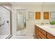 Main bathroom with a walk-in shower, and a spacious vanity with generous cabinet space at 1425 Mt Laurel Dr, Winter Springs, FL 32708