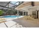Relaxing pool area with screened enclosure, covered patio, and outdoor seating at 1425 Mt Laurel Dr, Winter Springs, FL 32708