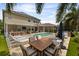 Enjoy the expansive outdoor living space featuring a pool, spa, bar, and dining area, perfect for entertaining at 14744 Spotted Sandpiper Blvd, Winter Garden, FL 34787