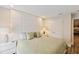 Cozy bedroom with a padded headboard, side tables, and soft, neutral tones at 14744 Spotted Sandpiper Blvd, Winter Garden, FL 34787