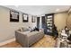This bedroom features hardwood floors, a sleek black display case, and sports memorabilia at 14744 Spotted Sandpiper Blvd, Winter Garden, FL 34787