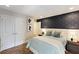 Charming bedroom with patterned wallpaper, soft blue accents, and ample closet space at 14744 Spotted Sandpiper Blvd, Winter Garden, FL 34787