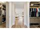 View of the entry to the main bedroom and organized walk-in closets on either side at 14744 Spotted Sandpiper Blvd, Winter Garden, FL 34787