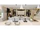 A spacious dining area offers plenty of seating and elegant lighting fixtures at 14744 Spotted Sandpiper Blvd, Winter Garden, FL 34787