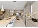Bright open kitchen featuring an island with dining, modern appliances and ample cabinet space at 14744 Spotted Sandpiper Blvd, Winter Garden, FL 34787