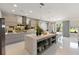 Modern, neutral-toned kitchen with an island and sleek appliances, filled with natural light at 14744 Spotted Sandpiper Blvd, Winter Garden, FL 34787