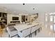 Spacious open-concept living area with staircase, stylish lighting, and modern decor and furnishings at 14744 Spotted Sandpiper Blvd, Winter Garden, FL 34787