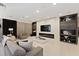 Bright living area with modern fireplace, custom shelving, stylish furniture, and contemporary decor at 14744 Spotted Sandpiper Blvd, Winter Garden, FL 34787