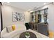 Relax in the cozy seating area with stylish decor and a chic wine bar for entertaining guests at 14744 Spotted Sandpiper Blvd, Winter Garden, FL 34787