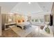 Relaxing main bedroom featuring a tray ceiling, a sitting area, and great natural light at 14744 Spotted Sandpiper Blvd, Winter Garden, FL 34787