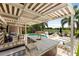 Entertain in style with this outdoor kitchen, pool, hot tub, and covered patio overlooking the manicured yard at 14744 Spotted Sandpiper Blvd, Winter Garden, FL 34787