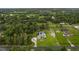 Expansive aerial view of home, showcasing the property's lush surroundings and neighborhood at 15038 Willow Ln, Tavares, FL 32778