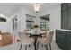 Charming breakfast nook with modern furnishings, natural light, and views of the outdoor pool area at 15038 Willow Ln, Tavares, FL 32778