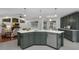 This kitchen features a large kitchen island and stainless steel appliances, with an open-concept design at 15038 Willow Ln, Tavares, FL 32778