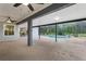 Large screened-in patio with a ceiling fan overlooking the pool and backyard at 15038 Willow Ln, Tavares, FL 32778