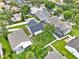 Overhead shot of a home with a white fence surrounding the property, plus verdant green lawns at 1706 Terra Cota Ct, Orlando, FL 32825
