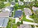 Aerial view of house showcasing the backyard, landscaping, and driveway within a residential neighborhood at 1706 Terra Cota Ct, Orlando, FL 32825