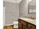 Bathroom features a vanity with granite countertops and a framed mirror at 1706 Terra Cota Ct, Orlando, FL 32825
