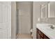 Neutral bathroom featuring a shower, vanity with tile countertops and floors at 1706 Terra Cota Ct, Orlando, FL 32825
