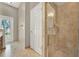 Neutral bathroom with tiled shower, glass doors and vanity with tile floors at 1706 Terra Cota Ct, Orlando, FL 32825