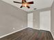 This bedroom features a ceiling fan, closet and nice flooring at 1706 Terra Cota Ct, Orlando, FL 32825
