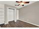 Bedroom offers hardwood flooring and a convenient open closet for optimal storage at 1706 Terra Cota Ct, Orlando, FL 32825