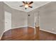 A spacious room featuring hardwood floors, neutral paint, ceiling fan, and recessed lighting at 1706 Terra Cota Ct, Orlando, FL 32825
