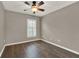 Bedroom featuring a ceiling fan, window with blinds and neutral paint at 1706 Terra Cota Ct, Orlando, FL 32825