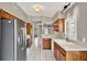 Practical kitchen layout with stainless refrigerator and functional design at 1706 Terra Cota Ct, Orlando, FL 32825