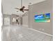 Open-concept living room featuring vaulted ceilings and neutral tiling at 1706 Terra Cota Ct, Orlando, FL 32825