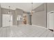 Spacious living area with tile flooring, open to kitchen, and ample natural light at 1706 Terra Cota Ct, Orlando, FL 32825